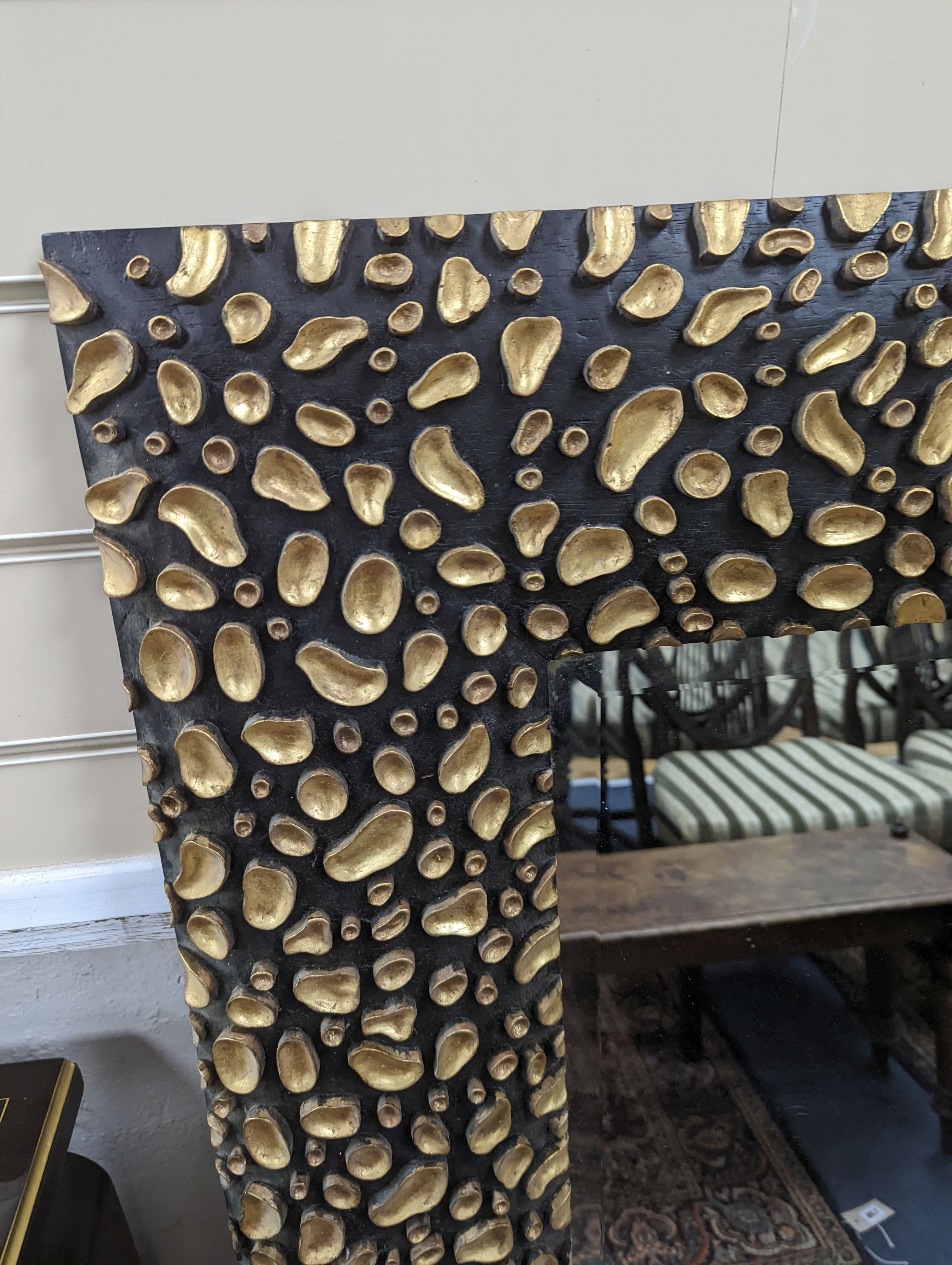 A large contemporary black and gold mirror. W-88cm, H-119cm.